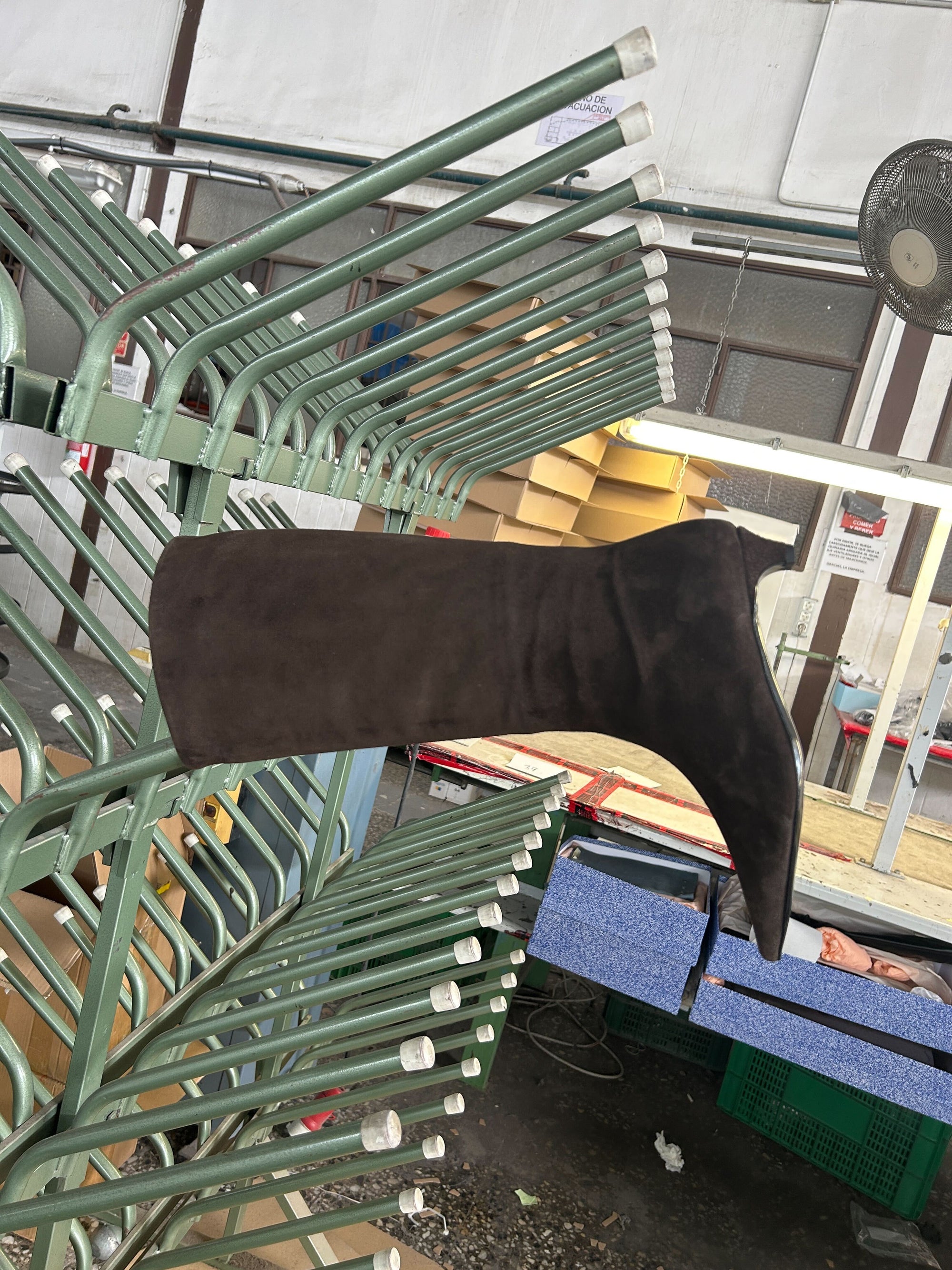 Brown boots in a factory. 