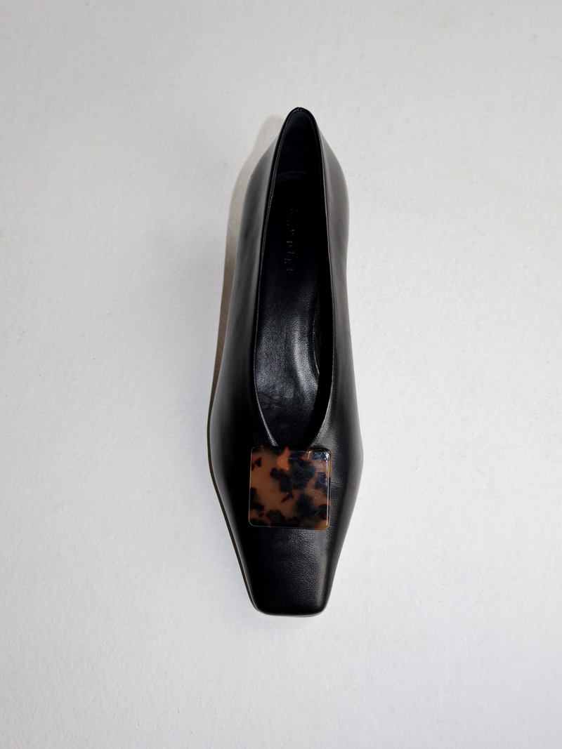Square tortoise coloured shoe clip on black heel