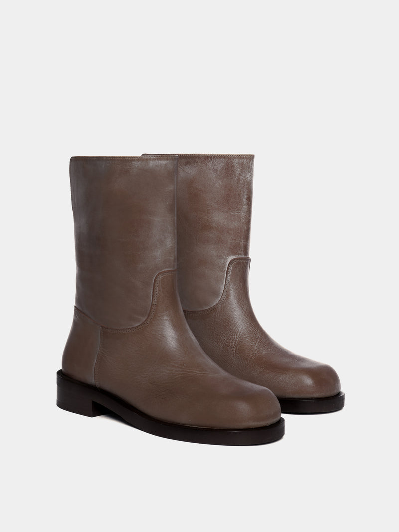 brown boot on light gray background