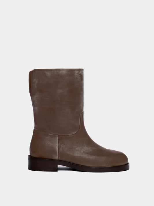 brown boot on light gray background