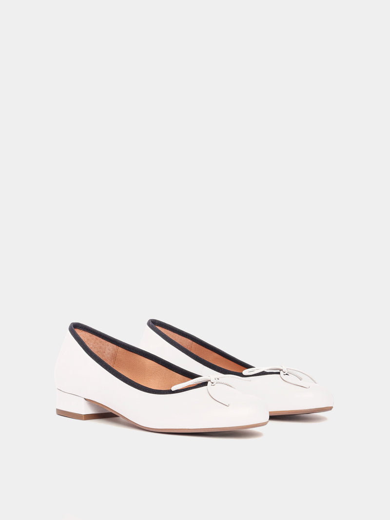 Cream leather ballerina pumps with black piping and cream bows