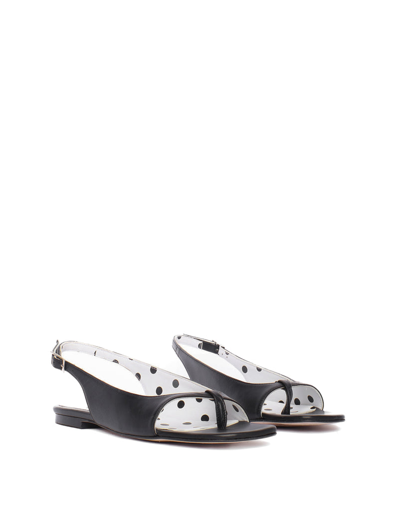 Flat black sandals with white polka dot lining