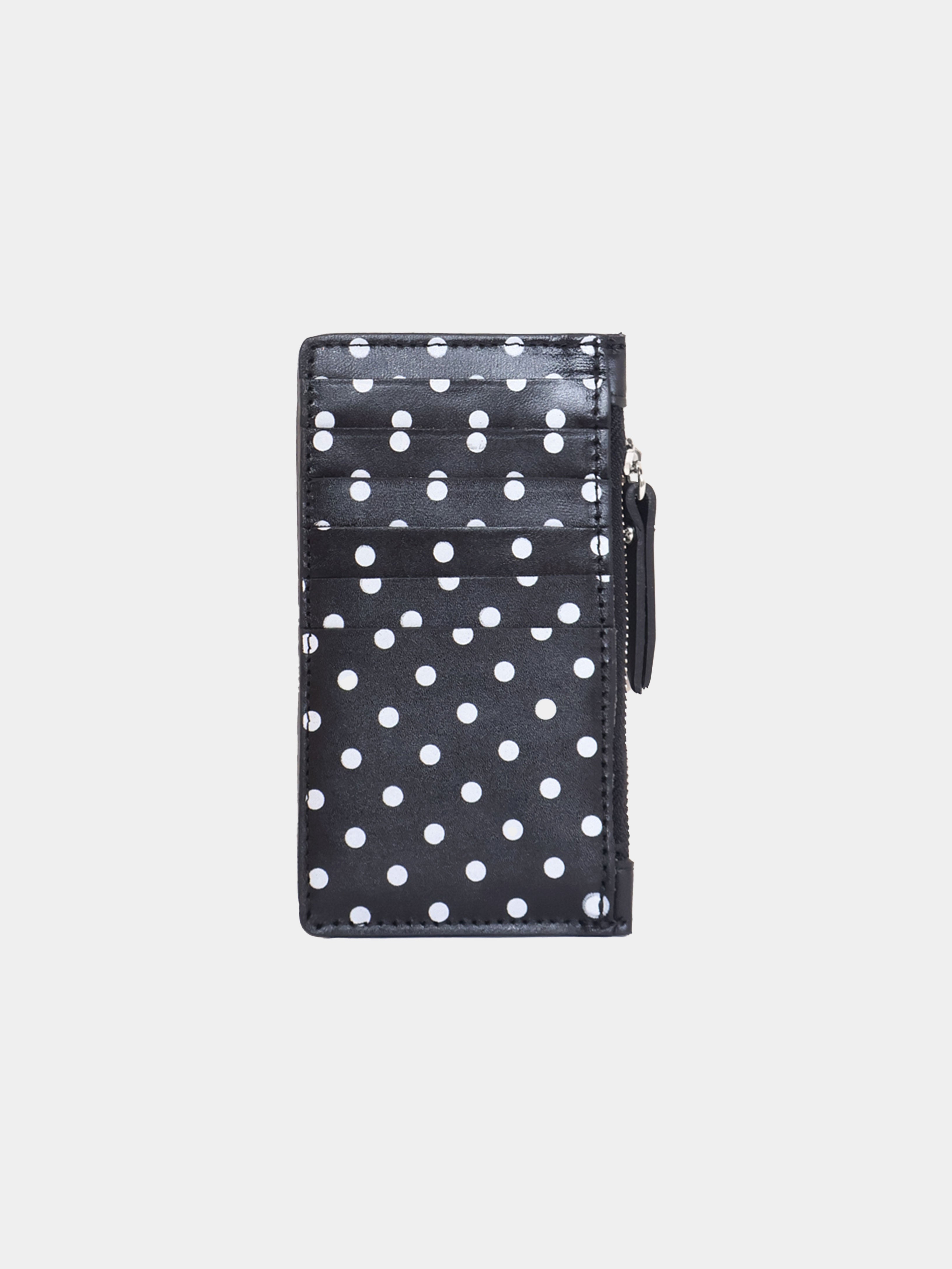 Black wallet with white polka dots on a light gray background