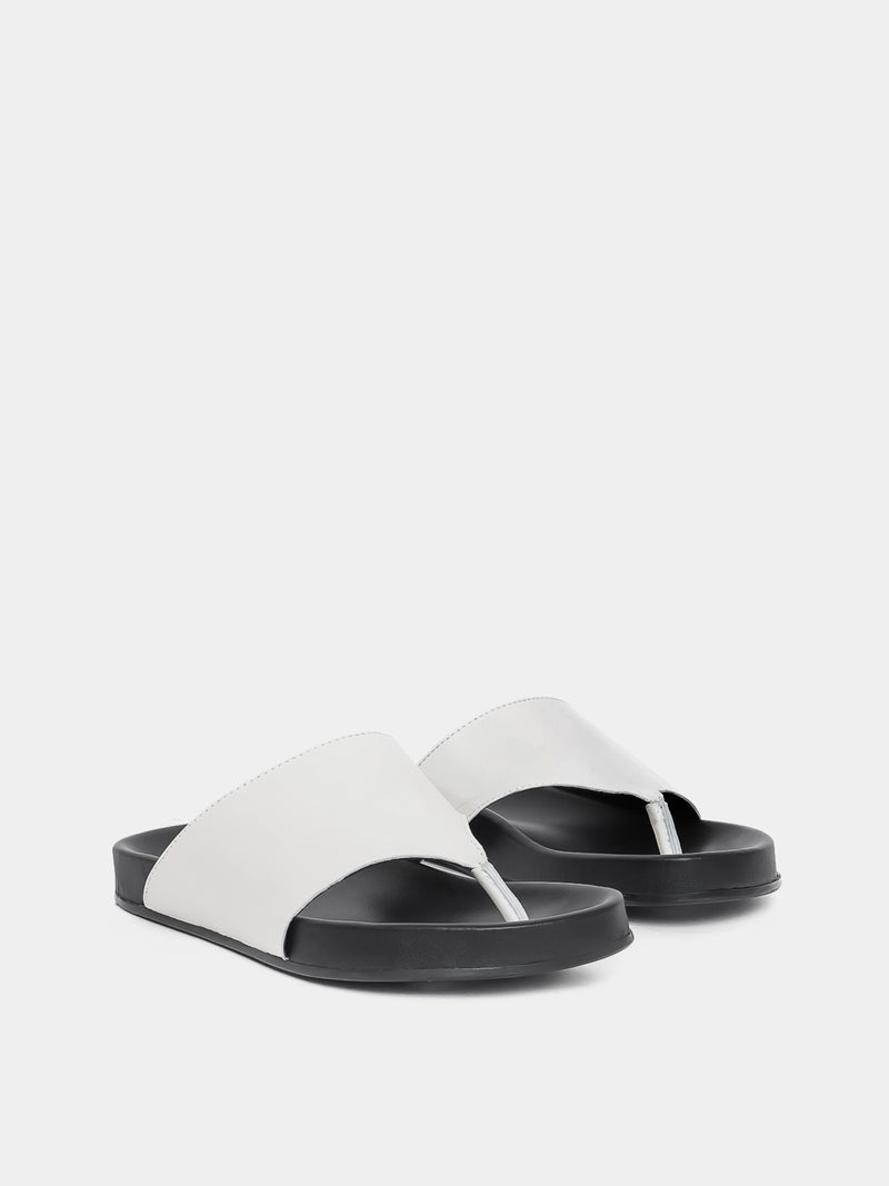 cream flip flop on grey background
