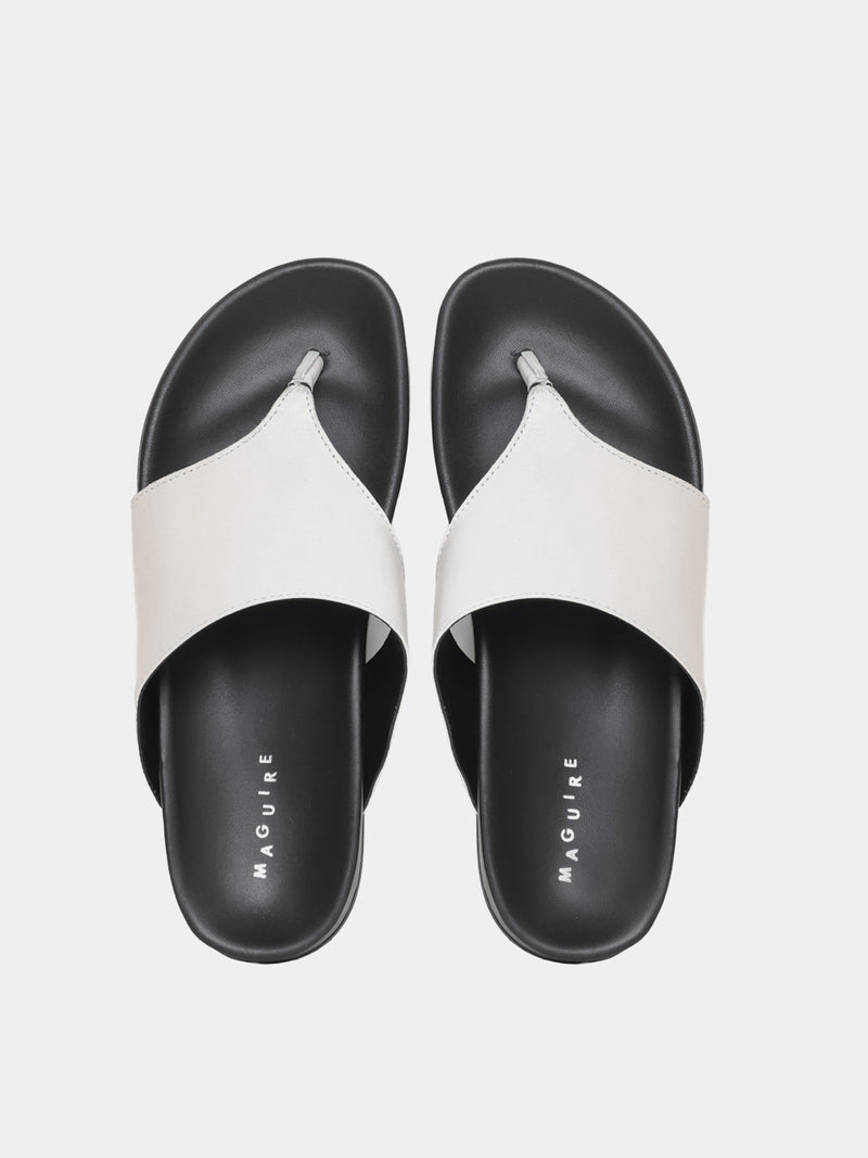 cream flip flop on grey background