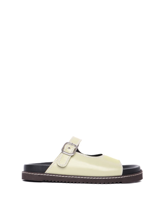 Madeira pistachio sandals with adjustable buckle straps and flat soles.
