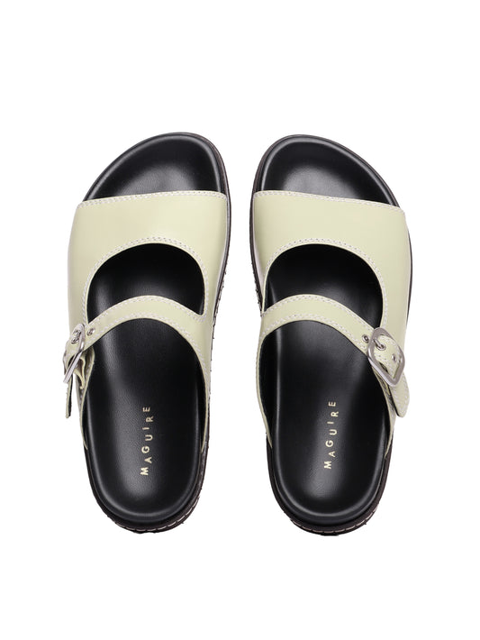 Madeira pistachio sandals with adjustable buckle straps and flat soles.