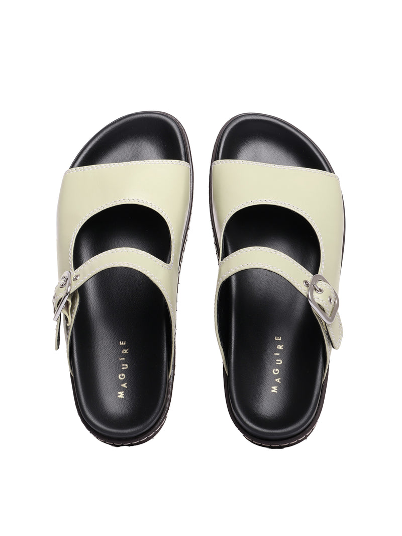 Madeira pistachio sandals with adjustable buckle straps and flat soles.