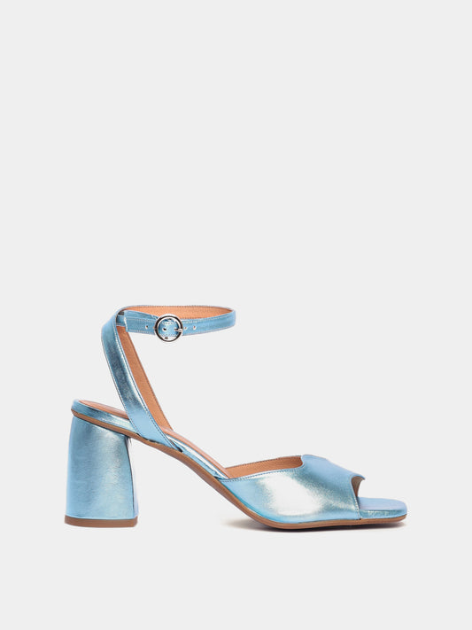 A blue metallic heel with an asymmetric wave design and an adjustable ankle strap.
