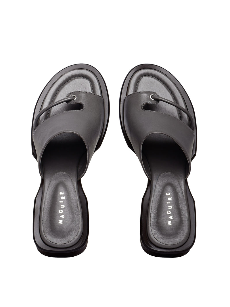 A pair of gray Mallorca slate sandals with a low heel and soft upper, placed against a plain background.