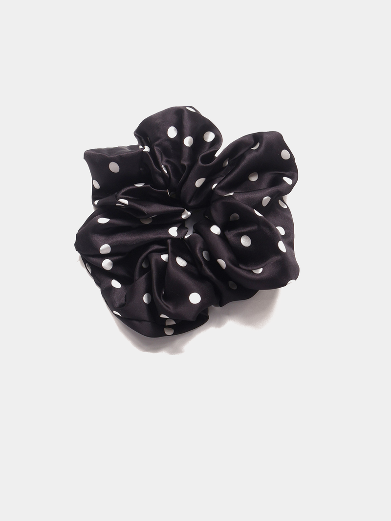Oversized black and white polka-dot scrunchie.