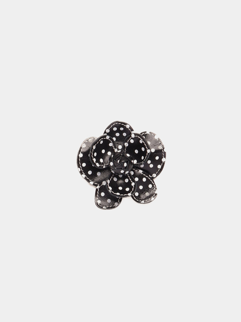 Black and white polka dot leather flower clip with white contrast stitching