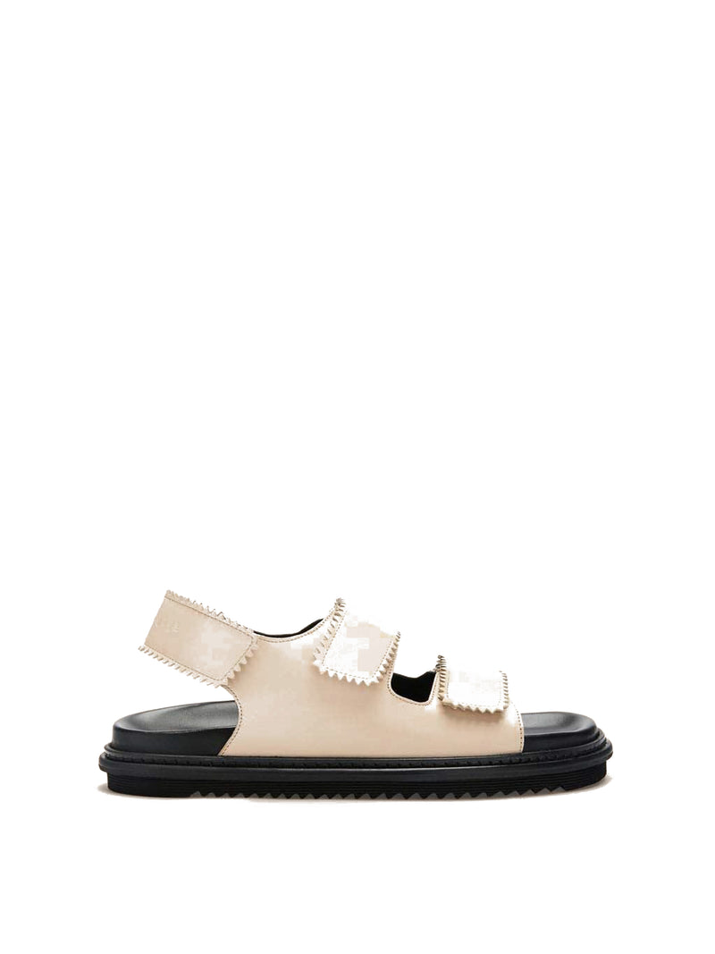 Tavira buttermilk leather sandal with two adjustable front straps and one back strap, side view.
