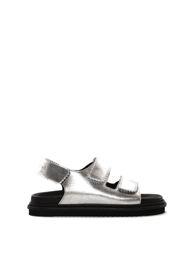 Tavira silver leather sandal with two adjustable front straps and one back strap, side view.