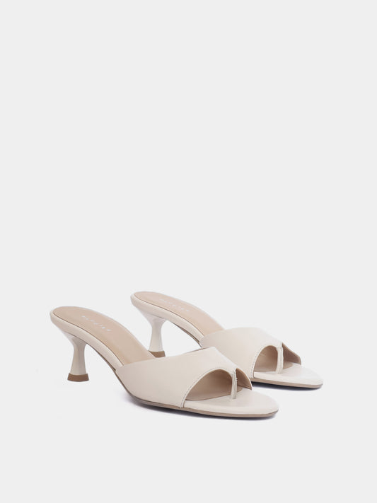 Front view of cream colored open toe heeled sandal on white background