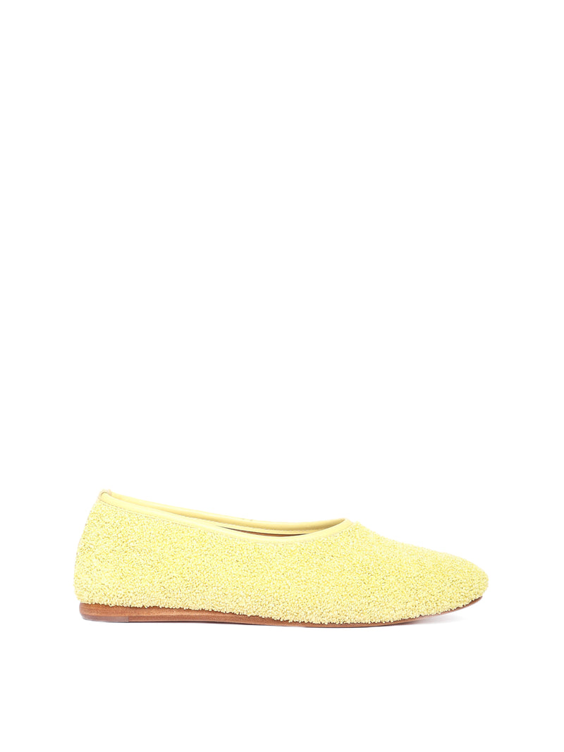 Ballerina flat made of yellow raffia
