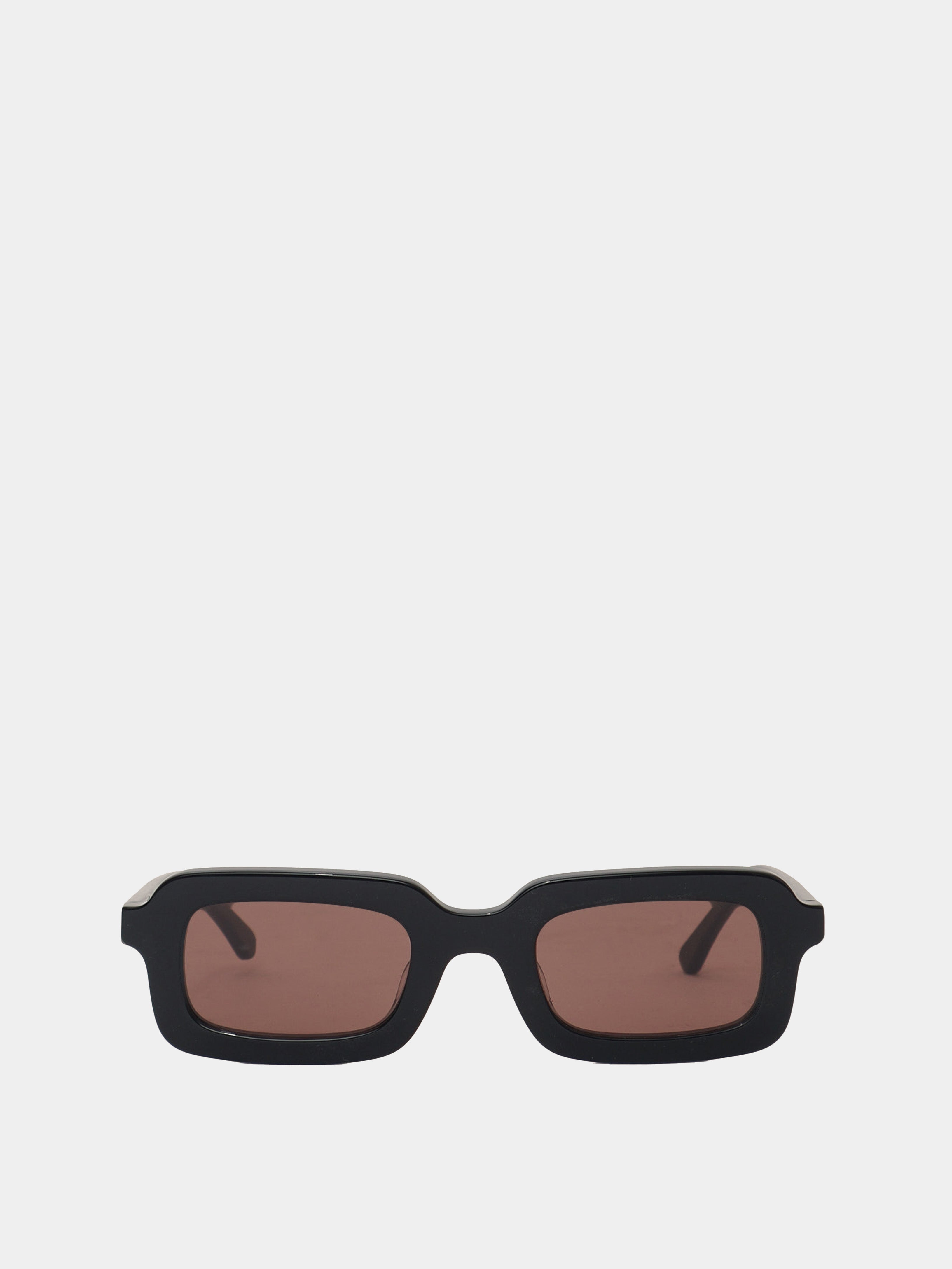 Rectangle shaped sunglasses in a black plastic colour with a brown lens. 