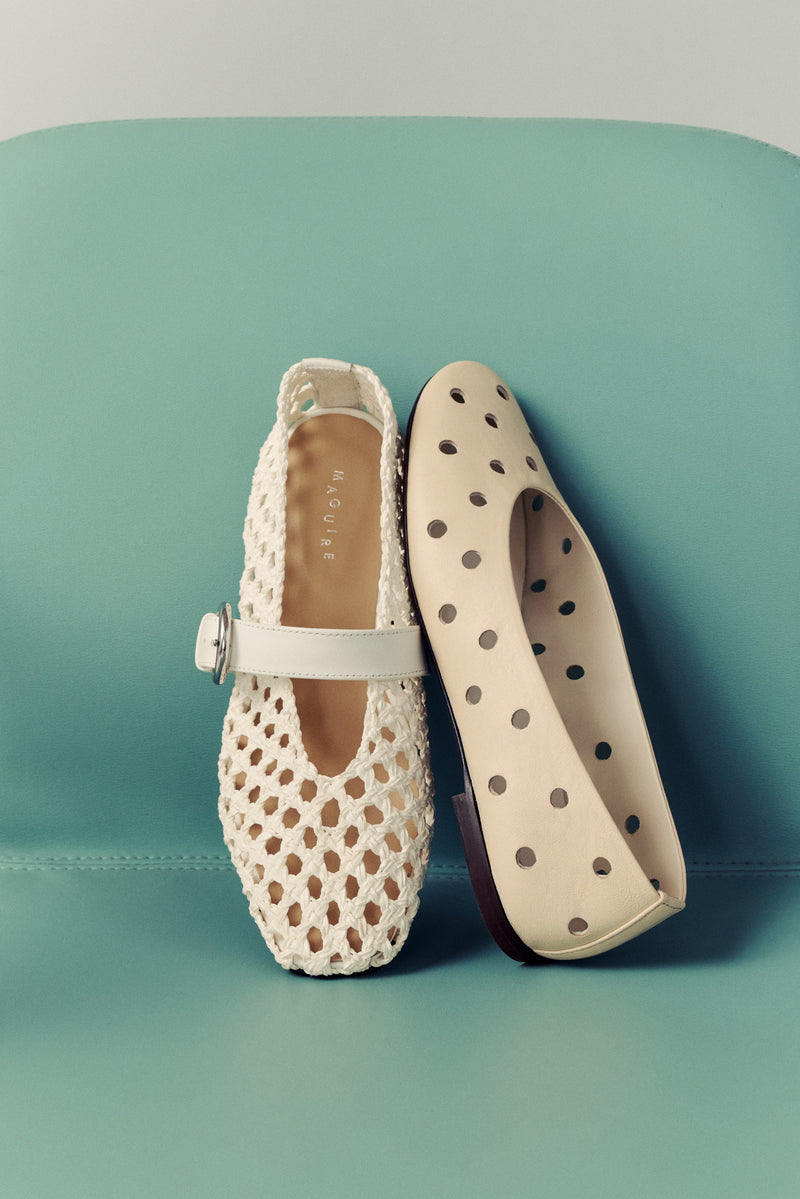 mint chair with two cream ballet flats, one woven and one with perforated round cut outs