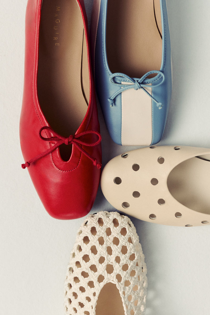 four ballet flats on white background