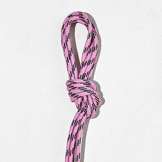 Pink laces with a knot on a white background