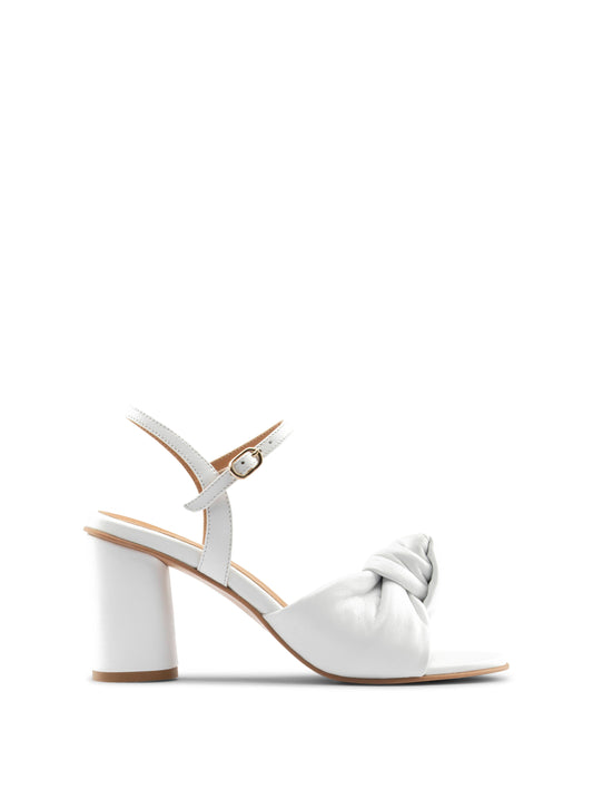 White sandal with a knot detail on a white background