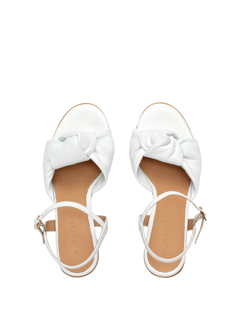 White high-heel with an ankle strap and leather knot
